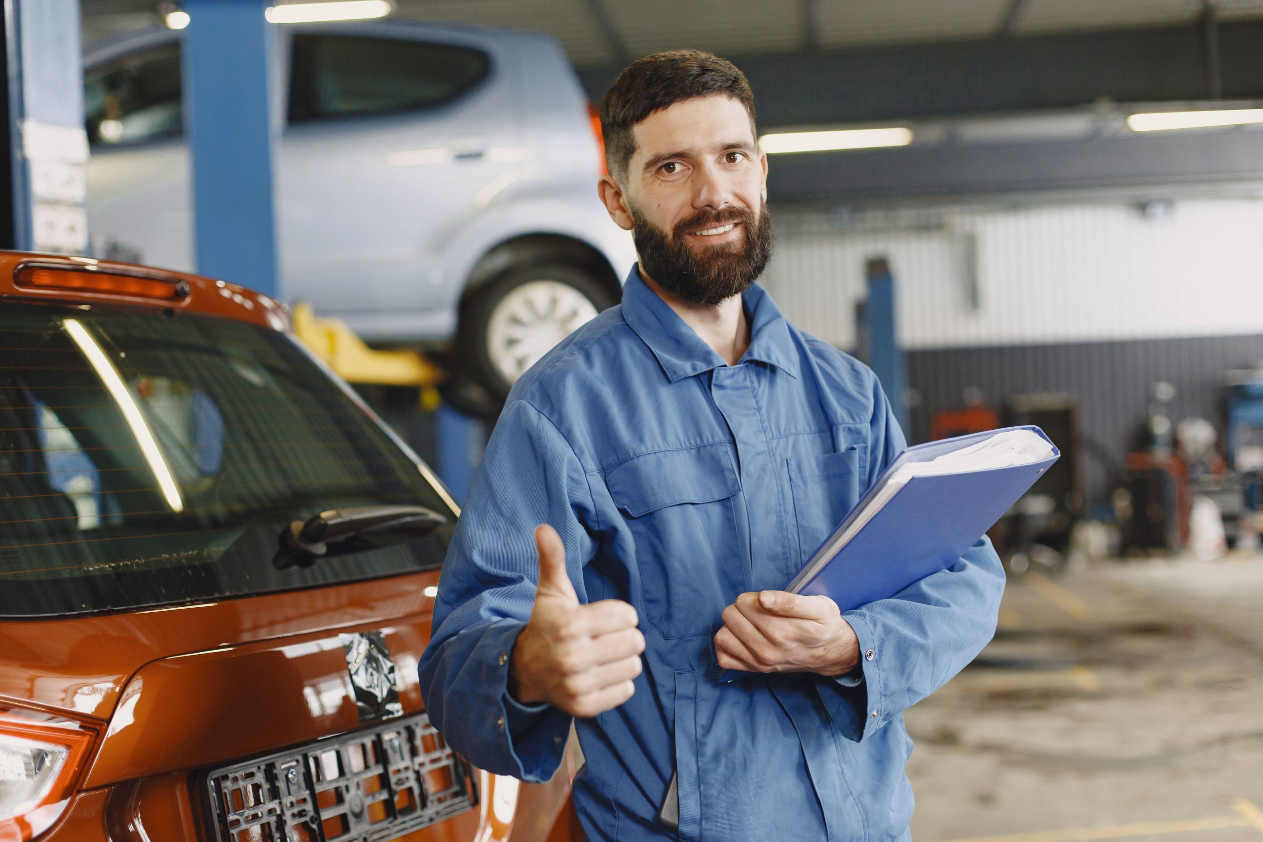 A car repair technician getting ready to inspect a car in a shop in Bossier City