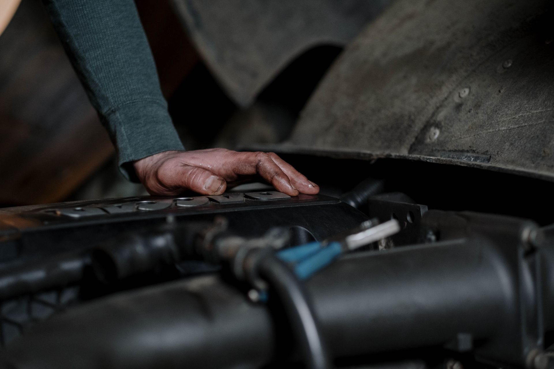 A mechanic inspecting an engine in a car repair shop in Bossier City