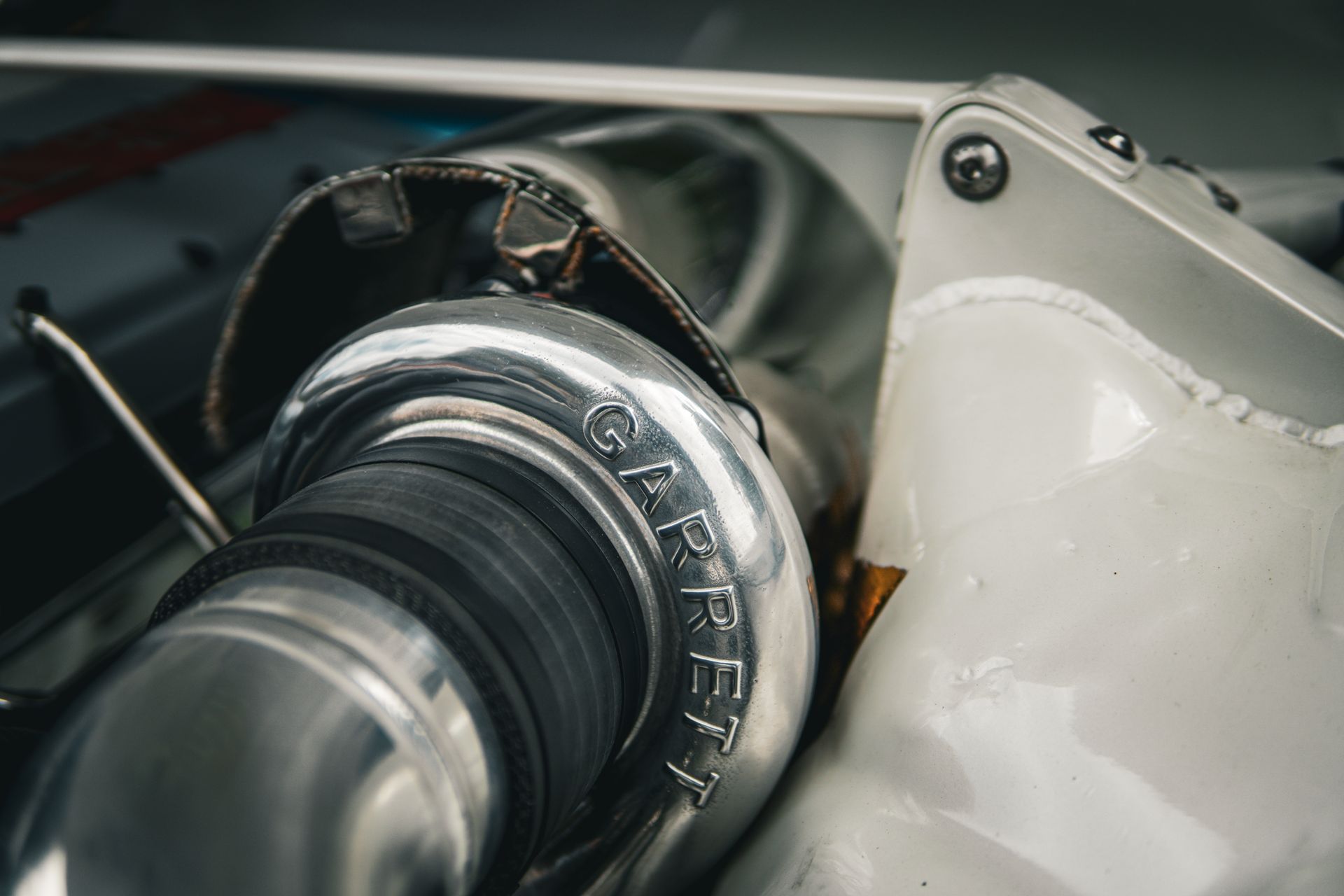 A silver Garrett turbocharger part in an auto repair shop in Bossier City